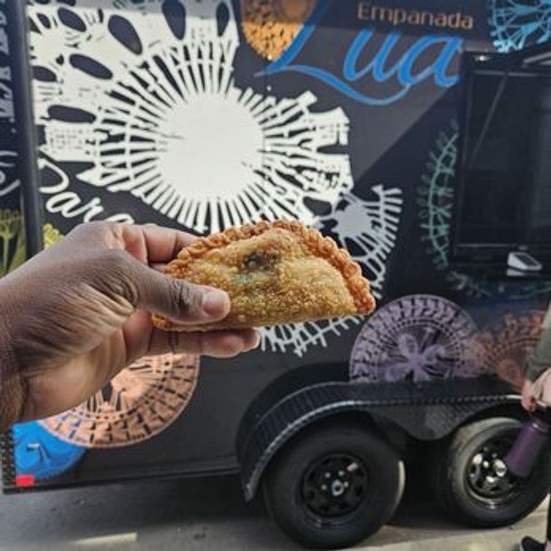 Lua Food Truck — Comfort food on the go including baked and fried empanadas, tacos, crispy wings, and crinkle cut fries! **Important change: Be one of the first 40 IN LINE at the truck and enjoy $10 off your order. Don't miss out on this delicious adventure! Please express interest - it helps us plan better! Plus, you'll get reminders.